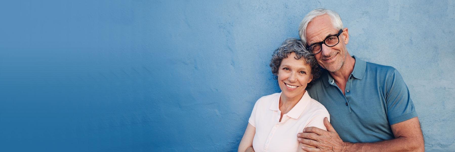 older couple hugging & smiling l dentist east dallas