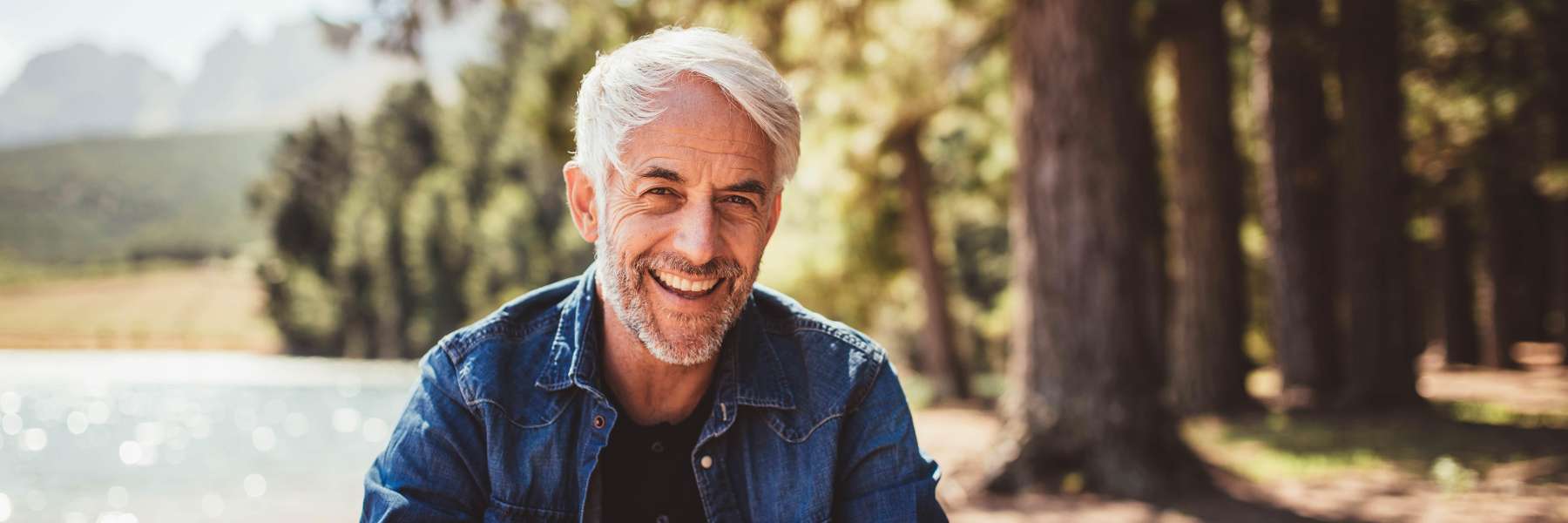 man with white hair smiling