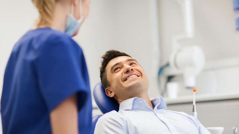 Dental Emergencies | Man sitting in a chair