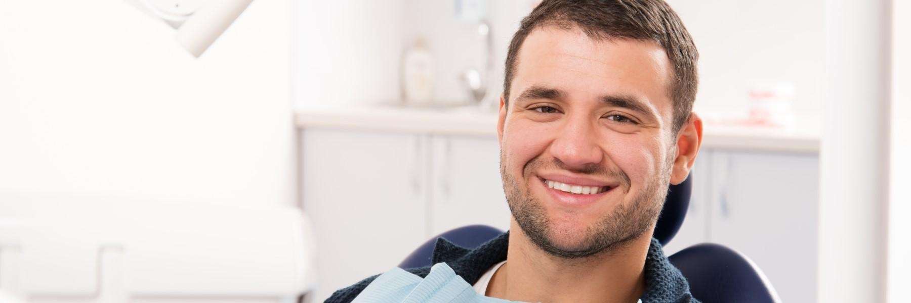 an image of a man sitting in a dental chair