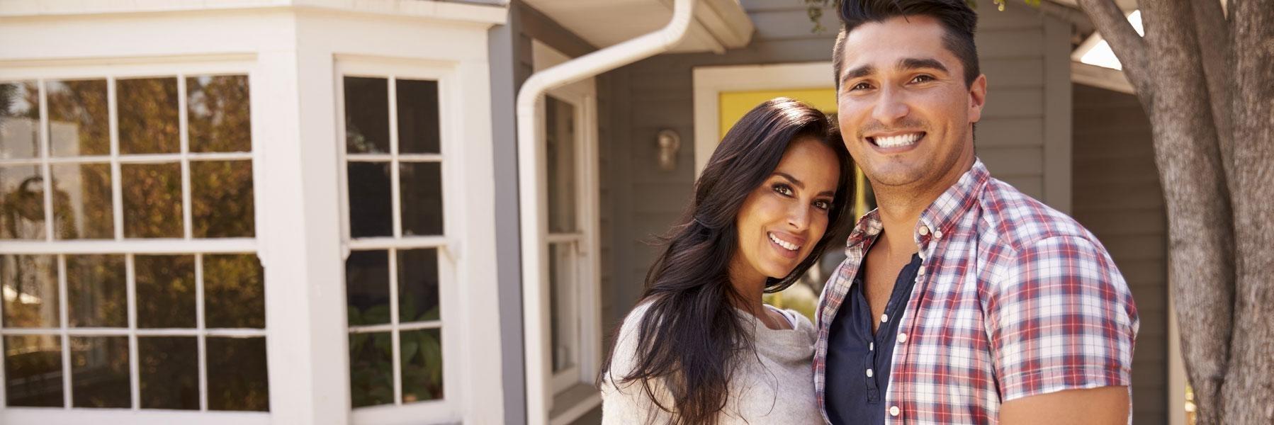 young couple standing outside home l dentist mesquite tx